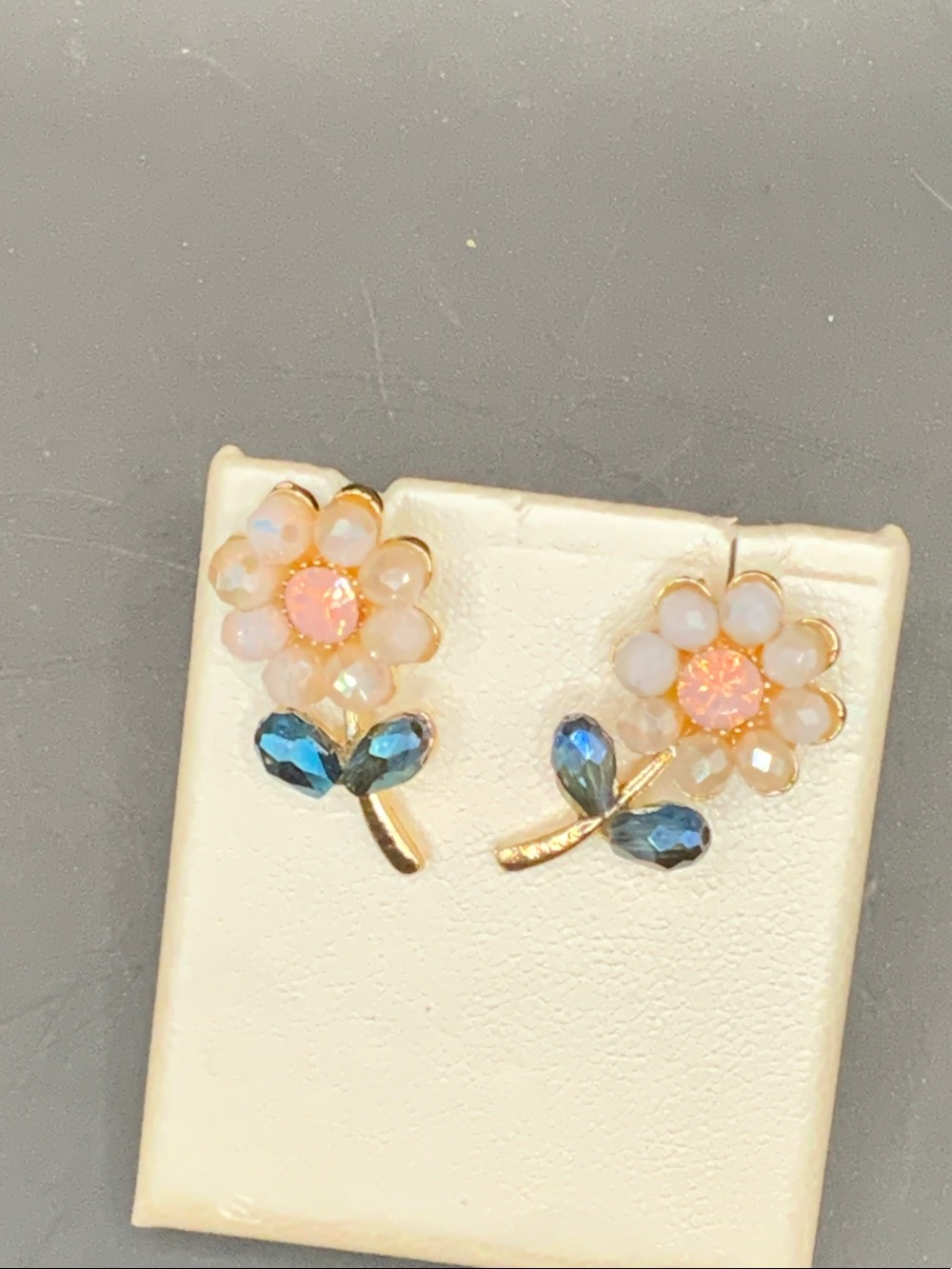 Gold Floral Stud Earrings with Pink Centers and Blue Leaves